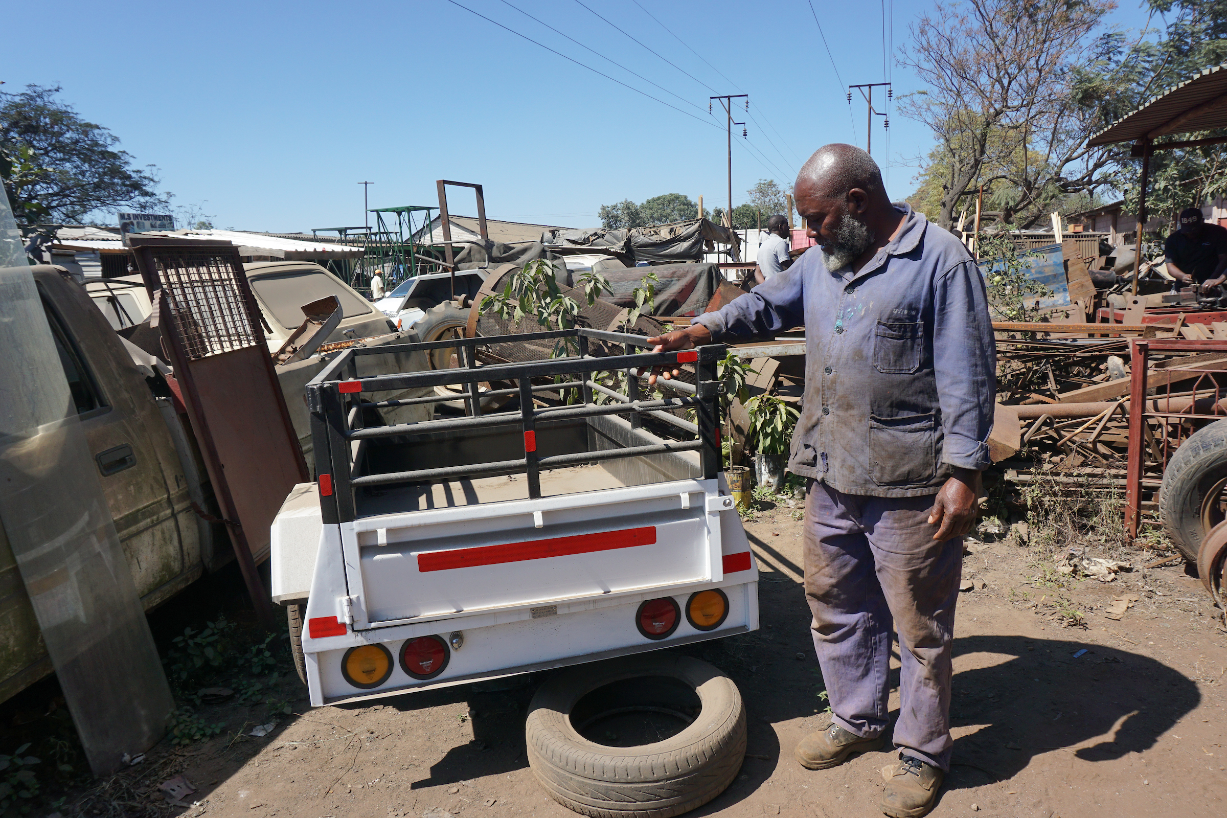 Andrew Ngondonga, a small-business owner, checks on projects around his metal fabrication shop in Mutare, Zimbabwe